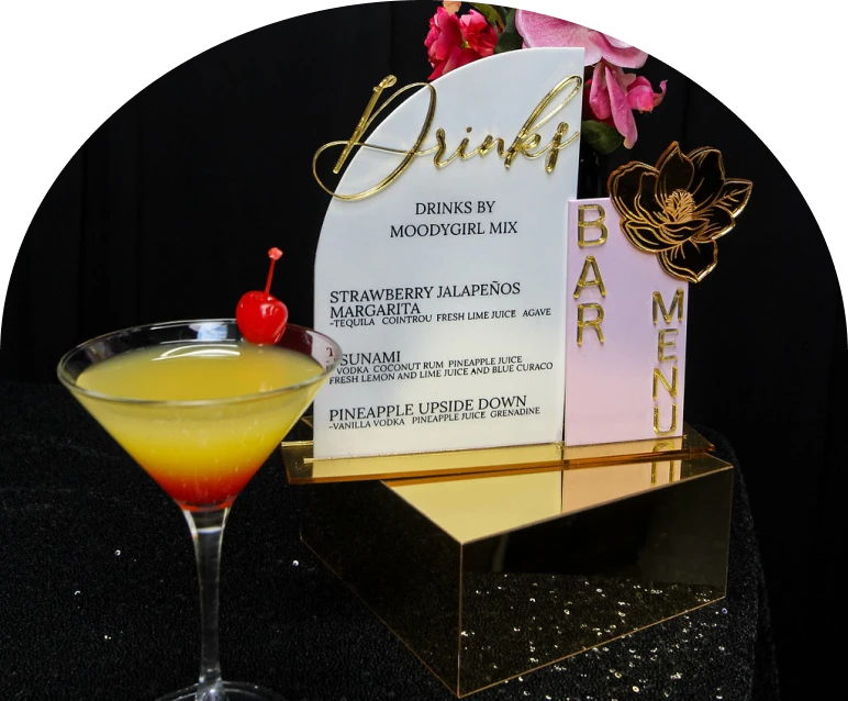 Yellow cocktail with cherry garnish
