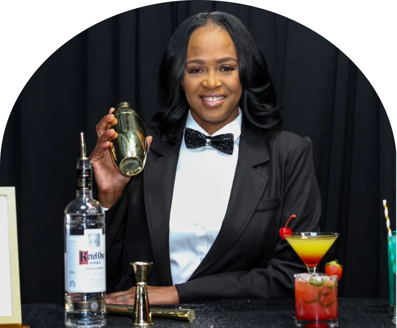 Bartender holding shaker with cocktails